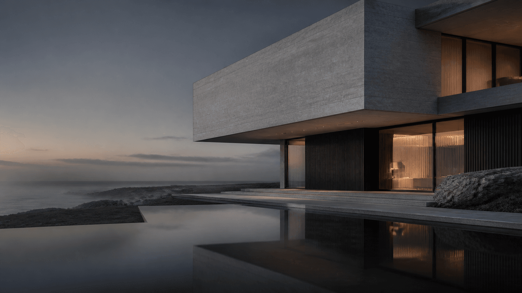A quiet limestone residence beside a reflecting pool at dusk